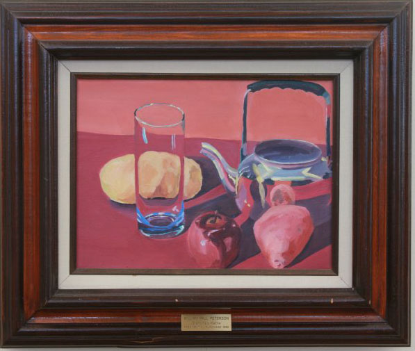 "Grandma's Kettle" by William Peterson. Still life painting with red and pink table and wall. A piece of bread, a glass cup, an apple, a pear and a silver teapot are arranged in the center. 